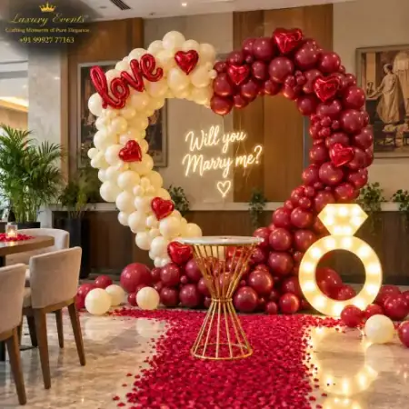 Marry Me setup in DLF Phase 4 Gurugram with burgundy heart balloon arch, neon sign and marquee diamond ring